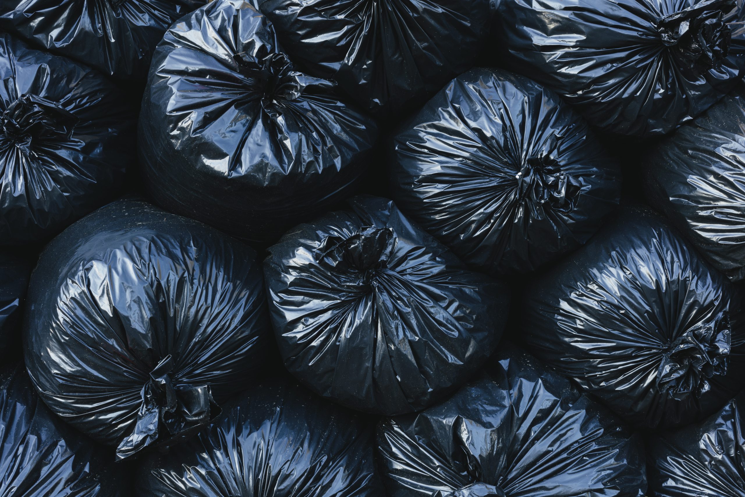 Pile of black plastic garbage bags. ,Pile of black plastic garbage bags