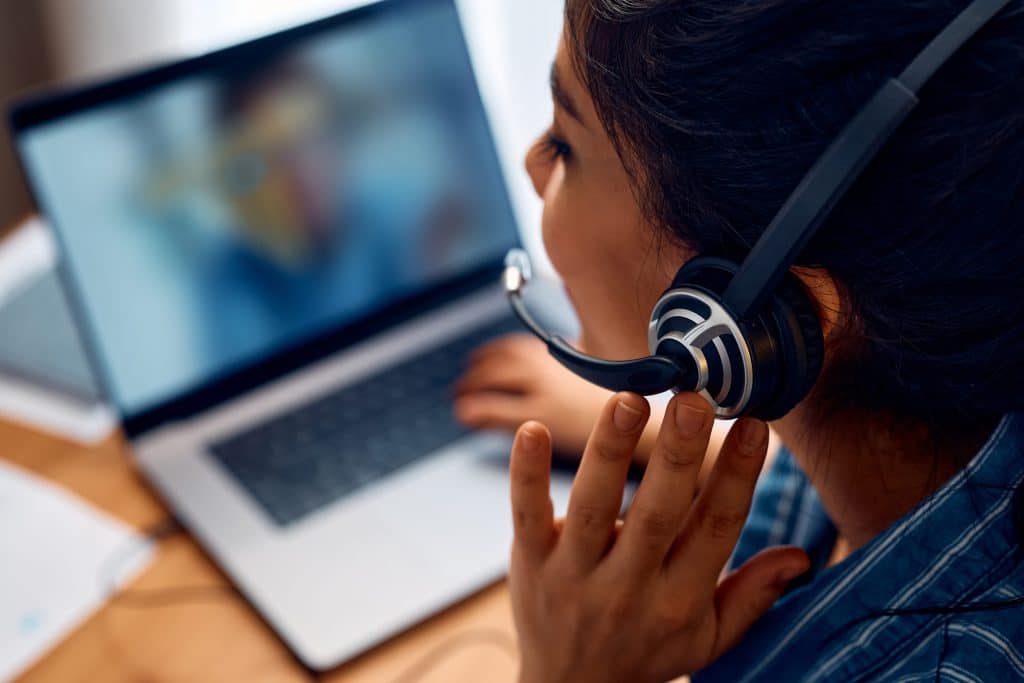 Close up of woman talking via headset for aı call center

