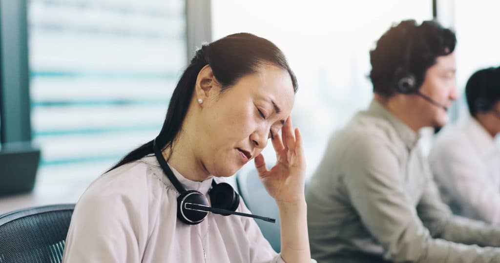 Business and woman in office, headache and stress with burnout, customer service
