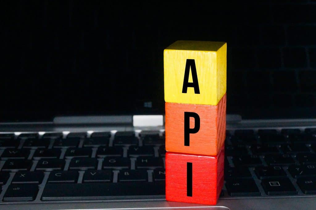 dıwass API Concept with Blocks on Laptop Keyboard
