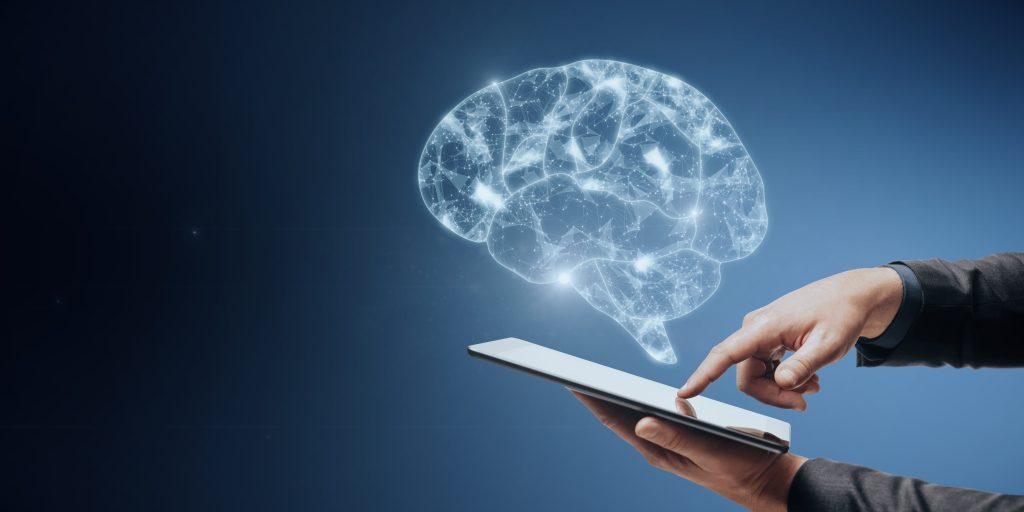 Close Up Of Businessman Hand Pointing At Mobile Phone With Low Polygon Brain Wireframe Mesh On Blue representing AI
