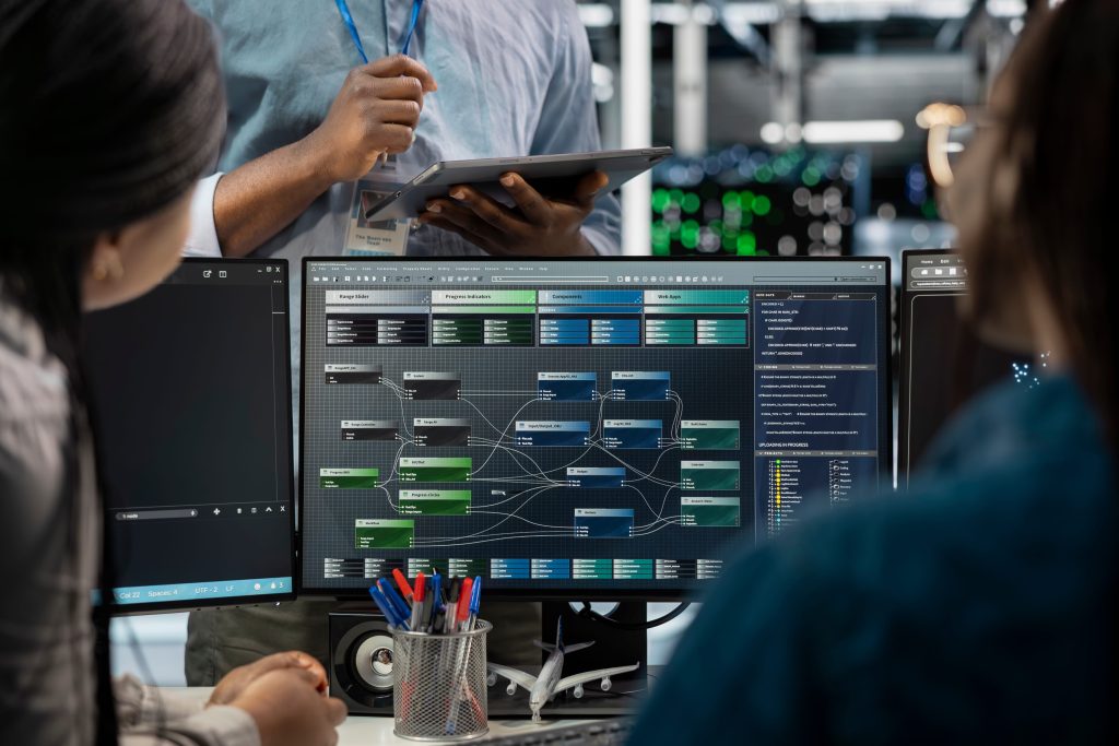 Close up of waste data center employees using PC to visualize AI neural networks