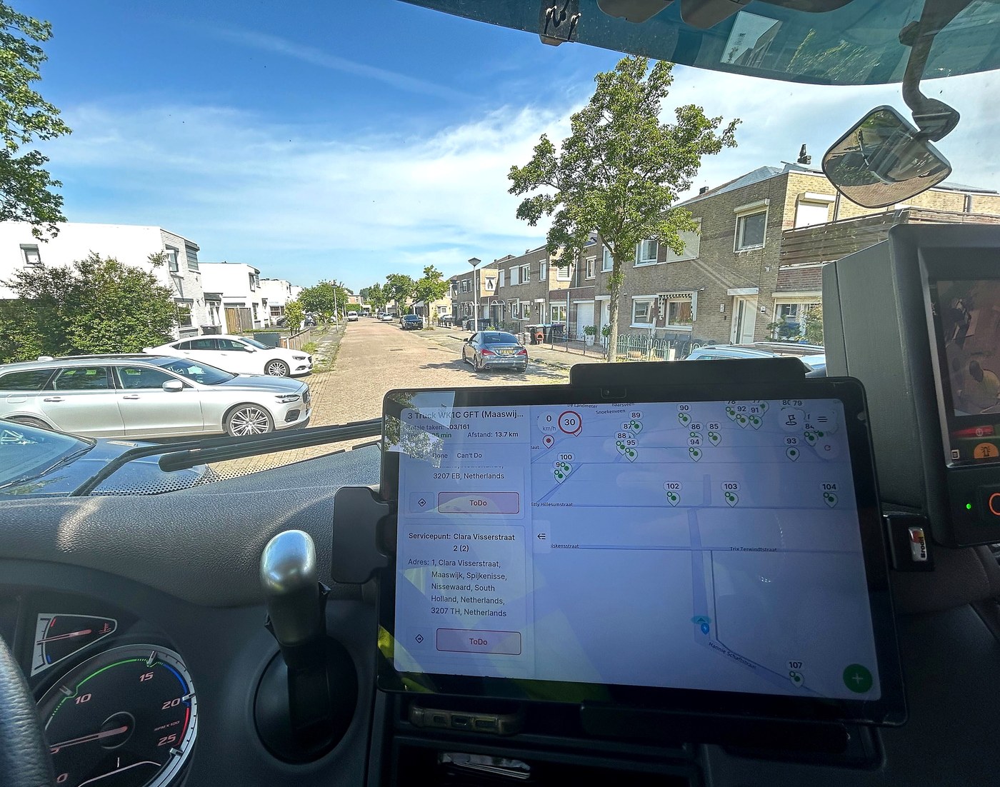 In-cab tablet showing a collection route and task list at a commercial worksite
